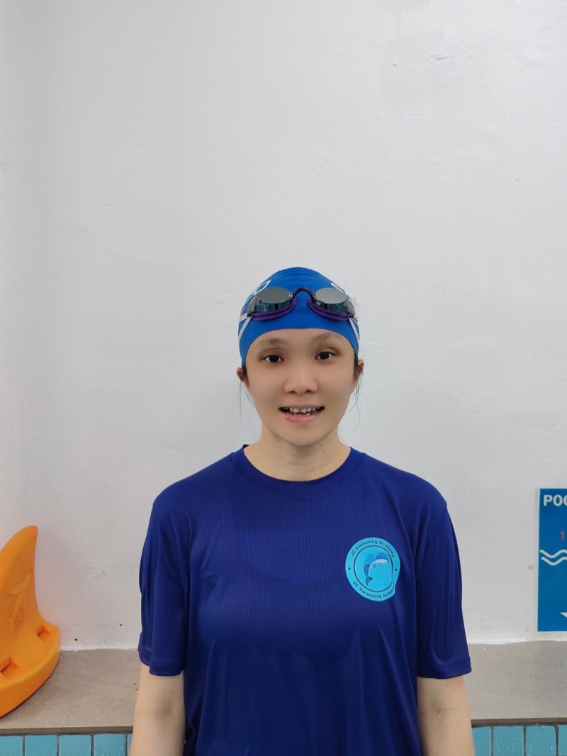 Coach Vanessa Wong, kids and water safety coach, poolside in her swim cap and goggles